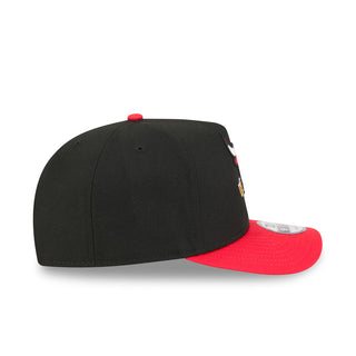 Black baseball cap with red underbrim and side cartoon patch, adjustable snapback