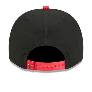 Black cap with red adjustable strap featuring bull logo, open back view