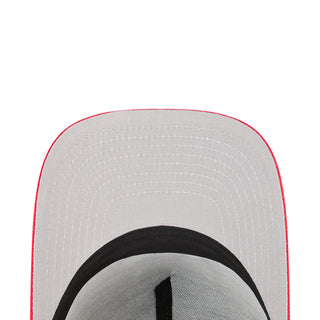 Close-up of gray cap panel with red trim and black inner band