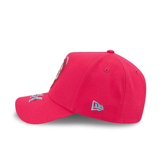 Red baseball cap with New Era logo on side and multicolor skull embroidery