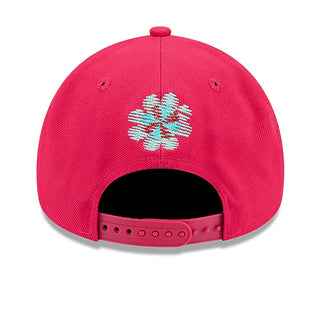Red baseball cap with back snowflake-style embroidery