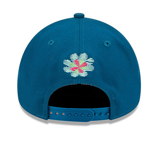 Blue A-frame cap back with small colorful floral skull graphic