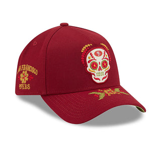 Red A-frame baseball cap with side embroidered sugar skull and gold leaf design