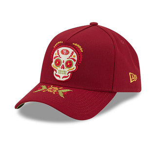 Red A-frame baseball cap with embroidered sugar skull crest and small side New Era logo