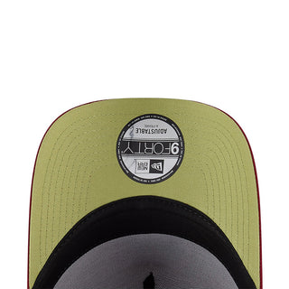 Olive A-frame cap with circular interior label and adjustable strap, view from back