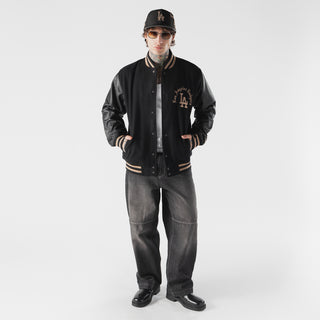 Men's black varsity jacket with LA logo on chest, striped ribbed cuffs and hem.
