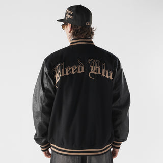 Men's black varsity jacket with large back lettering and striped rib trim at hem and cuffs.