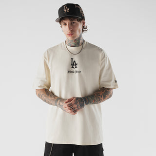 Beige men's T-shirt with LA Dodgers chest logo and 'Bleed Blue' print