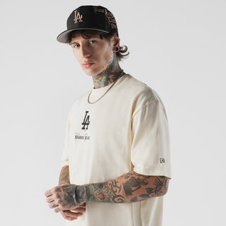 Beige men's T-shirt front view with LA Dodgers logo and 'Bleed Blue' text