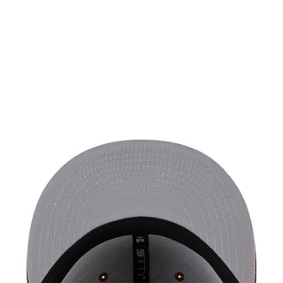 Gray baseball cap interior with black underbrim and red eyelets