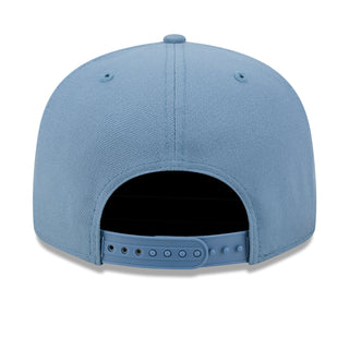 Faded blue baseball cap with open crown and snapback strap at back