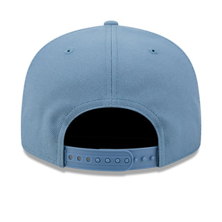 Light blue baseball cap back view with ventilation eyelets and snap strap
