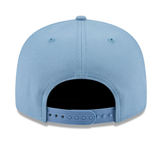 Light blue baseball cap back view with adjustable snap strap and vent eyelets