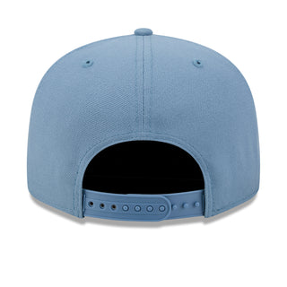 Faded blue baseball cap with open back panel and adjustable snap strap