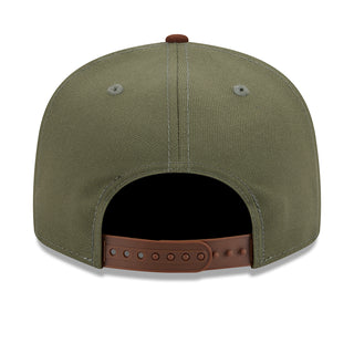 Olive green baseball cap with open back and brown snapback strap