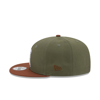 Olive and brown two-tone baseball cap with A logo patch