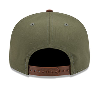 Olive two-tone baseball cap with brown snapback strap and open crown