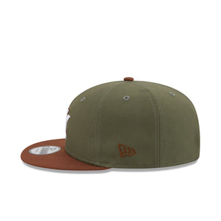 Two-tone olive baseball cap with brown underbrim and orange side logo