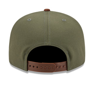 Two-tone olive baseball cap with brown snapback strap and stitched eyelets