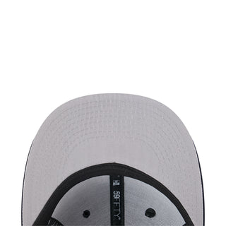 Light gray baseball cap interior view with black brim underside and label