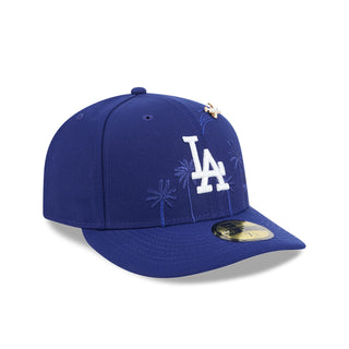 Blue baseball cap with LA logo, palm-tree embroidery, and side New Era flag pin.