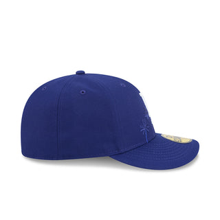 Blue baseball cap with palm-tree embroidery on the side panel.