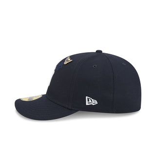 Navy baseball cap with gold bird pin and New Era flag on side panel