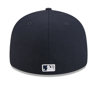 Navy baseball cap back with white MLB logo patch near the center