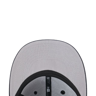Gray baseball cap top close-up with black inner brim and ventilation holes