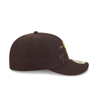 Brown baseball cap with palm tree embroidery and yellow side patch, angled view.