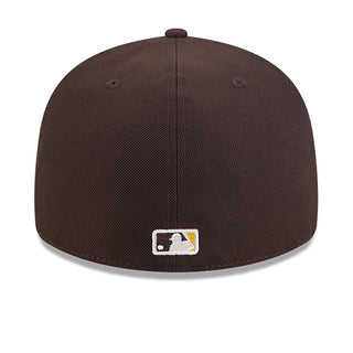 Brown baseball cap back with small square logo patch and stitched panel seams.