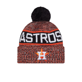 Orange knit beanie with black pom and white/black Astros stripe logo