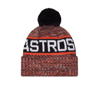 Orange knit beanie with black pom and 'ASTROS' lettering band