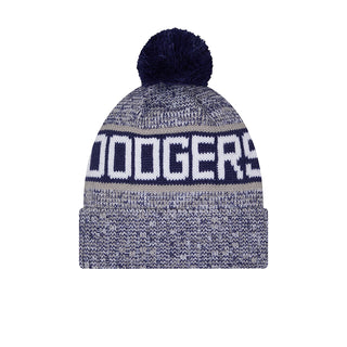 Blue knit beanie with navy pom and large front 'DODGERS' lettering.