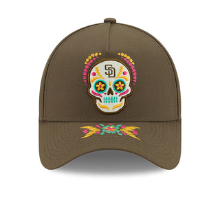 Brown baseball cap with colorful skull patch and embroidered star pattern on front