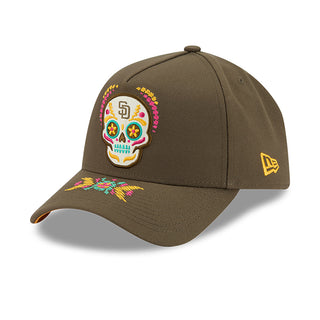 Olive baseball cap with colorful skull patch and New Era flag logo on side