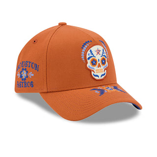 Rust baseball cap profile with multicolored skull patch and side team lettering