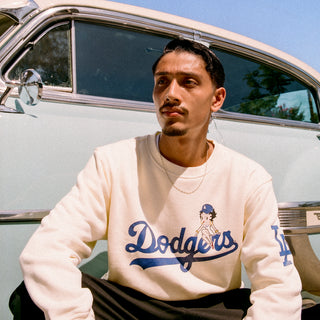 Unisex cream crewneck sweatshirt, front Dodgers logo and character graphic