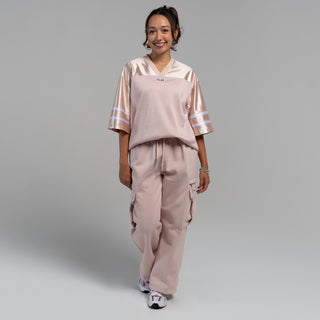 Womens oversized football jersey in sepia rose with V-neck and breathable perforated pattern
