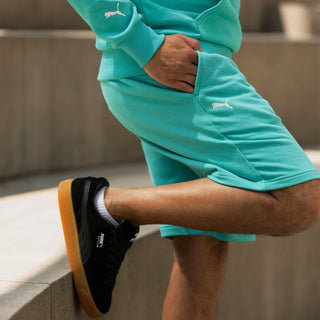 Men's teal shorts with PUMA logo on the leg and side seam