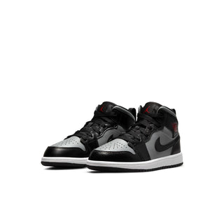 Kids black, grey and white high-top sneakers with red accents and Nike swoosh, laces