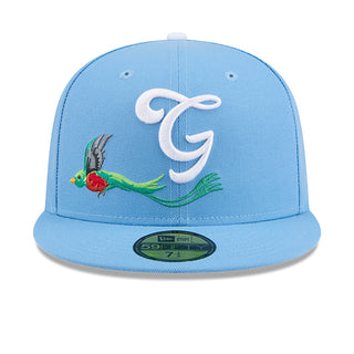 Light blue baseball cap with white front logo and colorful bird-and-leaf graphic