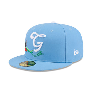 Light blue baseball cap with white “G” logo and green mascot graphic