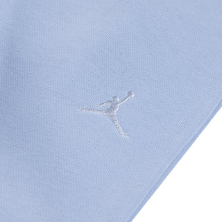 Light blue fleece fabric close-up with embroidered Jumpman logo