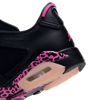 Black youth low-top sneaker close-up with pink collar lining and leopard midfoot trim