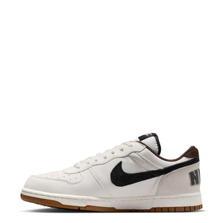 Men's Nike low-top sneakers, angled side view in sail white with black swoosh