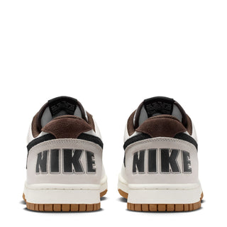 Nike low-top sneakers from the back, white uppers with black heel accents