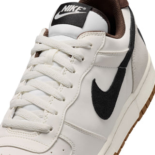 Close-up of men's Nike low-top sneaker lace-up front with black swoosh