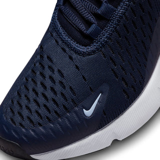 Youth sneaker upper close-up: dark navy textured knit with white Swoosh