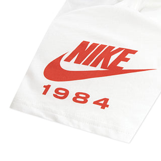 Youth white t-shirt hem graphic with red NIKE swoosh and 1984 text